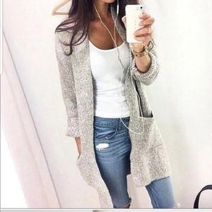 Cozy gray sweater with pockets.
